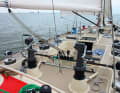 A winch for each line, halyard control near the mast and a small working cockpit from today's perspective