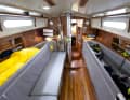 The restored interior remains seaworthy with high leeboards and saloon berths