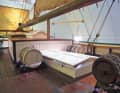 Workboat type: robust winch, food barrels and the large hatch for the engine room