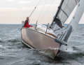 Large sail area and a narrow beam make the boat lean and require attentive steering and sail trimming