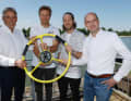 SailGP CEO Russell Coutts hands over the yellow helm to the Germany SailGP team with racing team owner Thomas Riedel (right), Sebastian Vettel and helmsman Erik Heil