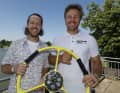 Helmsman Erik Heil and four-time Formula 1 world champion Sebastian Vettel with the symbolic yellow steering wheel for the German premiere in the SailGP