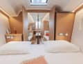 A wide double door connects the foredeck with the saloon. This links the two rooms both functionally and visually