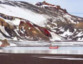 Kirchberger's bright red steel yacht in a secluded bay