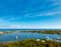 View of Hope Town Harbour from the lighthouse with the open Atlantic Ocean in the background