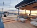The control stations are clearly separated from the living areas. In front of them is a large, sunken seating area with a dining table.