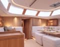 The saloon floor is slightly raised. The all-round glazed cabin superstructure provides plenty of light and transparency.