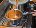 The pans are comparatively high and offer plenty of freeboard. The heat is distributed very evenly so that food rarely burns