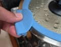 Silicone handles can be clamped onto the pouring rim to allow the pots to be moved with both hands