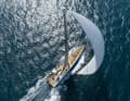 All headsails are furled, including the large A-sails.