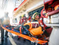 On the bridge deck of the "Eschwege", an injured person is to receive first aid