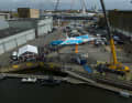 Large crowd at the crane appointment for the youngest Imoca in the class to date
