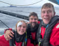 Co-Skipper Will Harris, Boris Herrmann und Rosalin Kuiper feiern ihr Bergfest vor Kap-Hoorn