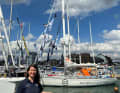 Ebru Yaral in front of the Allspice Yachting boat from South Africa