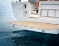 The bathing platform is high - good in waves. And it can accommodate two davits for the dinghy