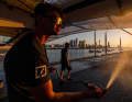 Kiel grinder Jonathan Knottnerus-Meyer showers the German F50 racing catamaran