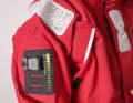 Special attachment points for emergency transmitters are attached to the jacket and trousers.