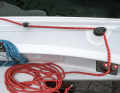 Double benefit: The curry cleat for the forward-guided sheet sits on a platform that also serves as a handle for hanging
