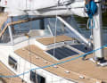 Teak handrails and plastic deck harmonise well