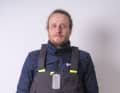The trousers extend over the chest and have insulated heat pockets.