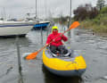 By dinghy on the jetty. The boat is entered via the bathing ladder at the stern, just like at anchor