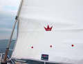 3. check the reefing mark: Many sails have two or three reefing marks in the form of red, blue or black circles glued to the foot area by the sailmaker. Depending on the desired reef, furl up to one of these points