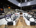 The double steering wheels are free-standing. This opens up the side passages to the laterally recessed running deck