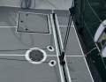 The Traveller works far aft in the open stern,...