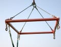 A crossbar takes the pressure of the straps off the boat and fixes the distance between the straps