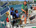In contact with children on the island: German Christian Sauer trains a few local schoolchildren on board his "Argo".