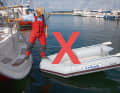 Wrong: the step over the bow ON the hose of the dinghy