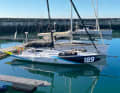 "Meganisi" at the jetty. Mast positioned far aft with plenty of halyard, brute-looking bow