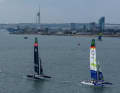 Portsmouth’s landmark, the Spinnaker Tower, can be seen in the background, whilst the Germany SailGP Team leads the fleet here.