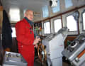 Captain Joachim Kaiser at the helm of the "Old Lady", which today sails again restored as the "Bleichen"
