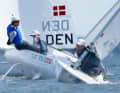 Ole Schweckendiek of the Kiel Yacht Club, pictured here in blue just behind top star Philipp Buhl, is leading the 2026 Kiel Week.
