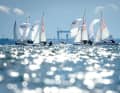 420: a two-person dinghy with a spinnaker and trapeze. Often sailed as a step up from the Optimist. Its big brother is the Olympic 470