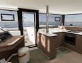 The huge galley impresses with its generously sized worktop, plenty of storage space and sweeping sea views. The front door leads directly to the forward cockpit.