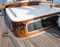 Patina everywhere: The varnished surfaces and fittings definitely show the age of the club yacht and its frequent use