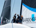 The crew led by skipper Quentin Delapierre are having a discussion on board.