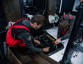Boris Herrmann and Will Harris try to align the V-belt of the generator