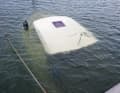 Only parts of numerous boats were still sticking out of the water