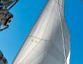A furled genoa opens strongly at the top, at the bottom it is too tight, the centre of pressure shifts aft