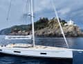 The backstay runs through a Hahnepot, the mainsail falls onto the carbon boom via the lazy jacks, and the bowsprit picks up the anchor.