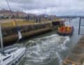 The sailor was assisted as he entered the lock.