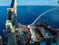 Trawlers hoist the bag on board