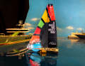 The Malizia Seaexplorer model sails in front of typical Monaco yachts.