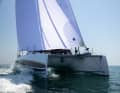 The hulls are slightly flared. This looks good, first and foremost, and helps with moulding during production. However, it has little effect on the boat’s sailing performance.