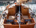 Division of labour: The helmsman sits behind a high coaming, well separated from the crew and the drum-sized sheet winches