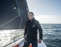 The 35-year-old Swiss-German on the bow of his Imoca