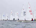 Arne Assmann (GER 42) and Ingo Hüter (GER 1227) are the first pursuers of the Dutchman Thies Bosch in the Olympic dinghies.